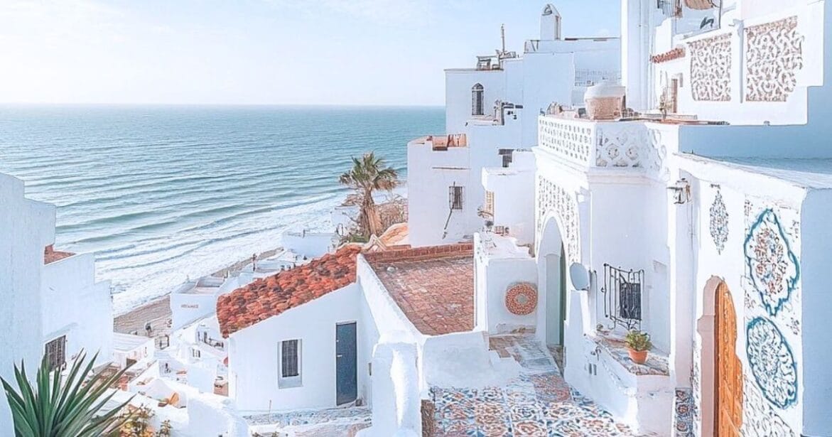 white buildings with beach in Asilah, Morocco