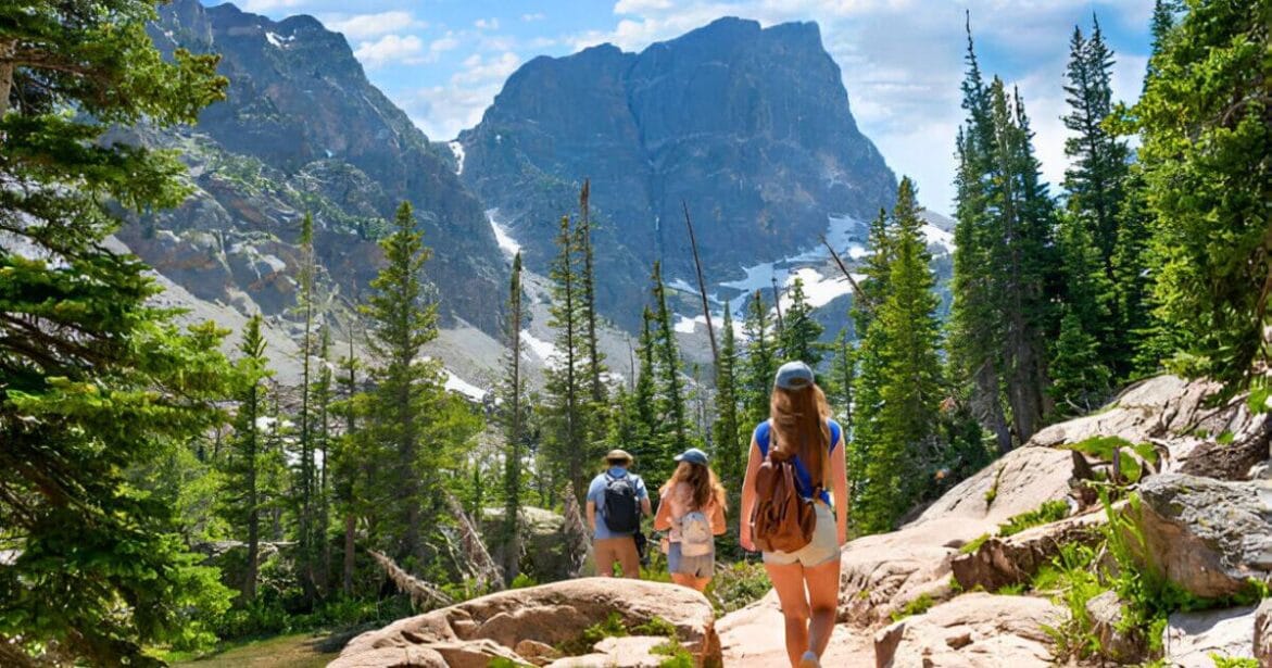 Family on summer vacation hiking trip in Colorado