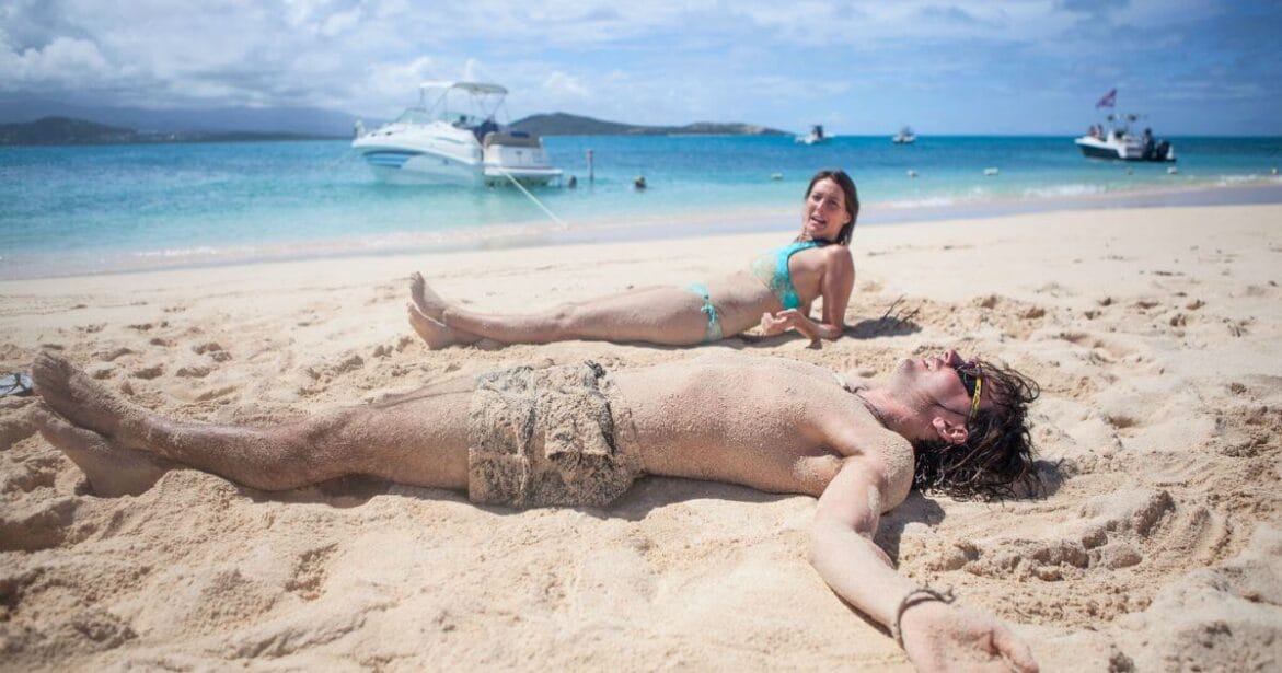 Romantic Couple enjoying the powdery white sand beaches of Icacos Island in Puerto Rico